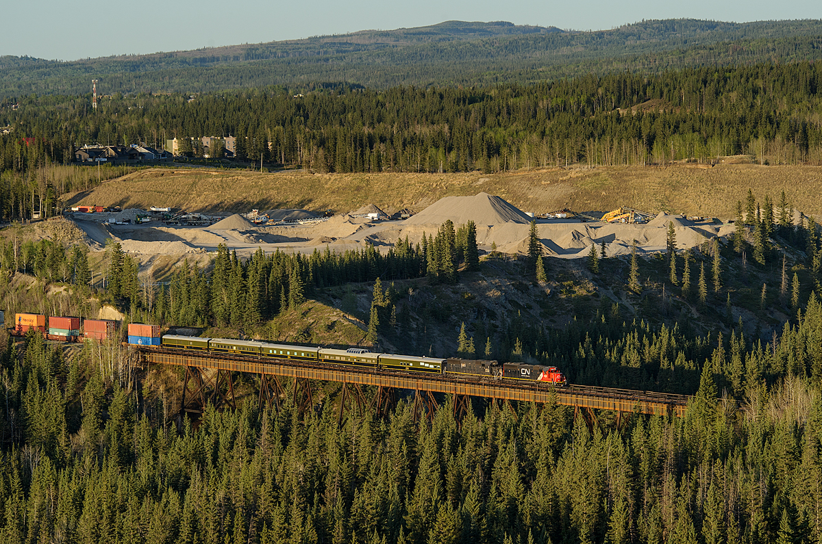 CN SD60 5482 and IC SD70 1005 lead Chicago-Prince Rupert train Q199 across the Prairie Creek trestle, west of Hinton on CN's Edson Sub. Hitching a ride on the headend are 5 CN business cars heading for Prince George for a Chairman's trip from Prince George to Prince Rupert.