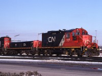 Clean yard switcher CN 7274 (GP9u) in then-new CN colour scheme is well matched with slug CN 274, resting near the Macmillan Yard Diesel Shop. Behind them is similar CN 7270 in the previous mainly black yard engine scheme. <br> 
My reference indicates CN 7274 had previously been CN 4595, before remanufacture by AMF Technotransport in 1993.