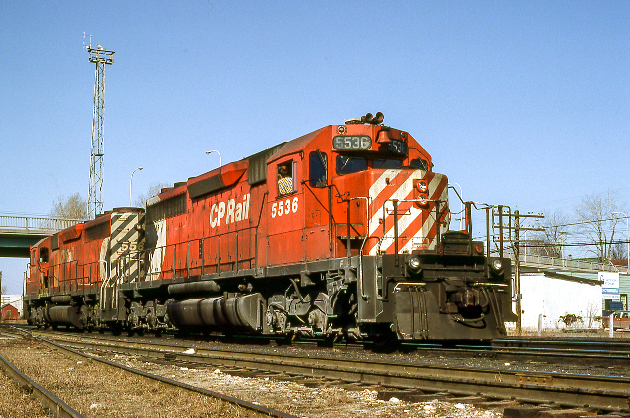 CP 5536 and 5563 sit in the cold sunlight of March 24, 1981 in London, Ontario. In several hours the sky would be heavy clouds.