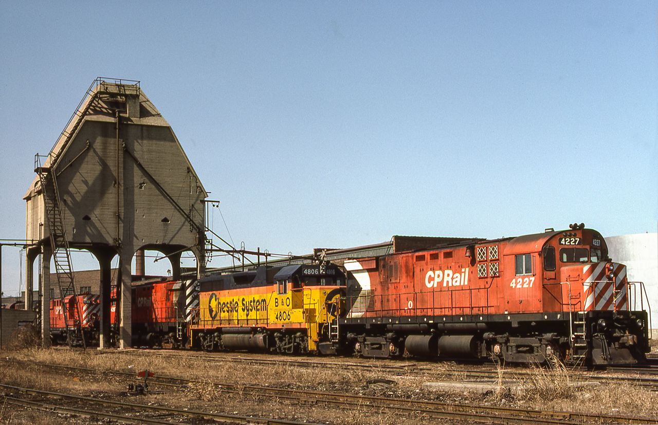 This may be the TH&B engine facility in Hamilton, Ontario, but on March 27, 1984, it looks like a CP facility. CP 4227 and several other CP locomotives share the ability with B&O 4806 in Chessie System paint.