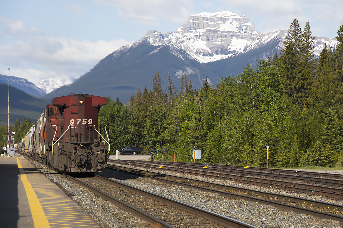 9759 shoves hard on the tail end of 120 cars of grain. The assault on Kicking Horse Pass begins........