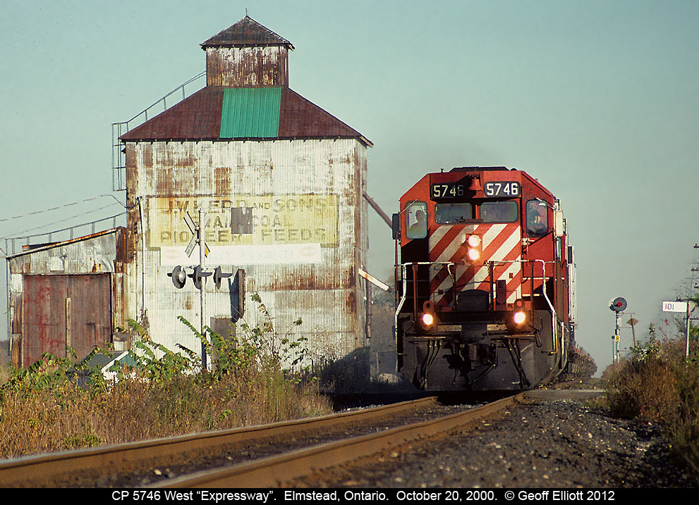 CP's now extinct "Expressway" used to run not only Toronto-Montreal, but also Detroit-Toronto.  Here we have the Toronto-Detroit train nearing Windsor as it passes the old "Ruggabers" mill in Elmstead back on October 20, 2000.  As you can see by how few trailers are on the train, this segment was bound to die as it can't compete had to compete against the mighty 401.....