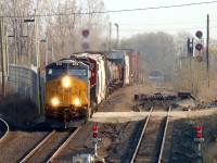 After seeing Mike Molnar's recent photo of CP T-27 from this location, I thought I'd upload a photo of when the former CASO main was still in use. Here CSX Rougemere (Dearborn Mi.) to CN Van de Water (Windsor) transfer D718 is seen accelerating down towards the tube and into the U.S. with a 25 car train. Freight on this train includes two hoppers from Windsor Salt, two boxcars and some coils from Morterm Docks, a tank from Diageo (Crown Royal), two ADM hoppers, two more boxcars from Morterm before a cut of Fords auto parts boxcars and a handful of gondolas from Zalev Bros Scrap. This train was unique in that it used CSX Canadian crews, and was the last train to use the original approach to the tunnel after other transfers were canceled over the years. CP now handles all traffic through here.