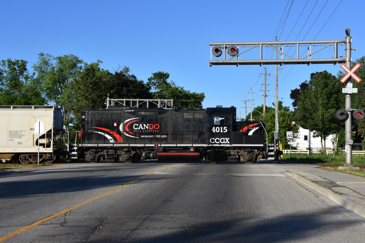 Just after 7am on a peaceful Friday morning finds CCGX 4015 working the north end of Orangeville Yard. In this scene the unit has paused right in the center of Townlne rd as the conductor (who is 2 hoppers behind) flips the switch to the spur that serves the Clorox Company of Canada Plant. After they drop their 2 hoppers off they will run around to the south end of the yard, couple onto their train and head south to Mississauga.  This will most likely be CANDOs last run ever on the line as Trulliums Start date to operating the line is said to be July 1 2018.