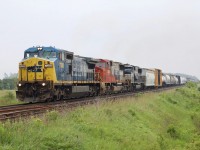 Another case of dreary day, cool power! CN train 384 is seen rolling on the south track at Tansley after a meet with 435. 