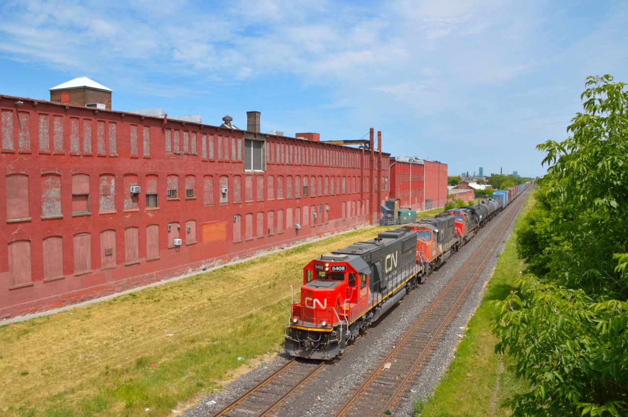Candy Factory Treat!  A nice catch of late CN A42231-16 is seen passing Hamilton's former candy factory on it's way towards Stuart Street Yard.  The ex-Oakway SD60 was a wonderful scene compared to the sea of GE's all day.