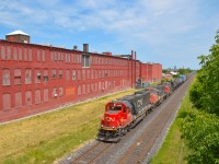 <b>Candy Factory Treat!</b>  A nice catch of late CN A42231-16 is seen passing Hamilton's former candy factory on it's way towards Stuart Street Yard.  The ex-Oakway SD60 was a wonderful scene compared to the sea of GE's all day.