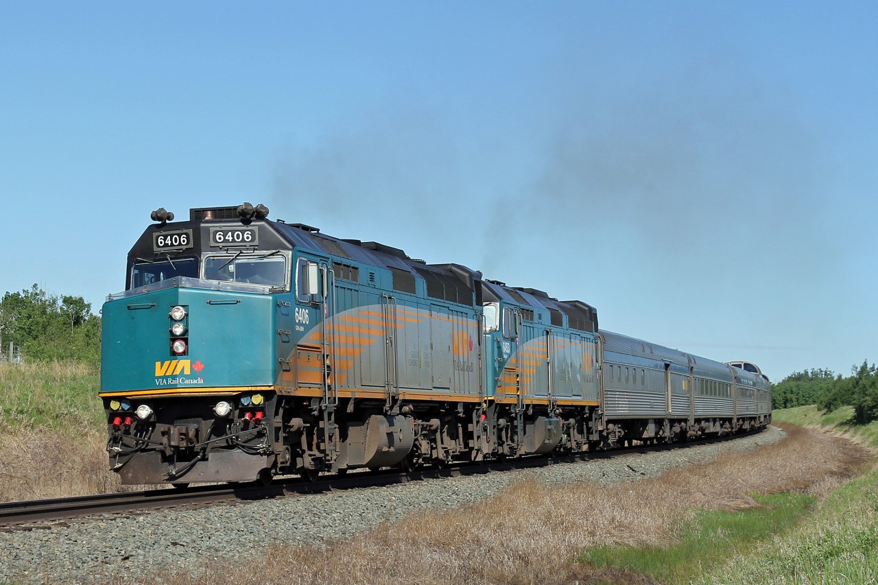 A late running #2 departs Tofield having been held for an hour +/- for no apparent reason.  There was very little other traffic moving this particular morning.