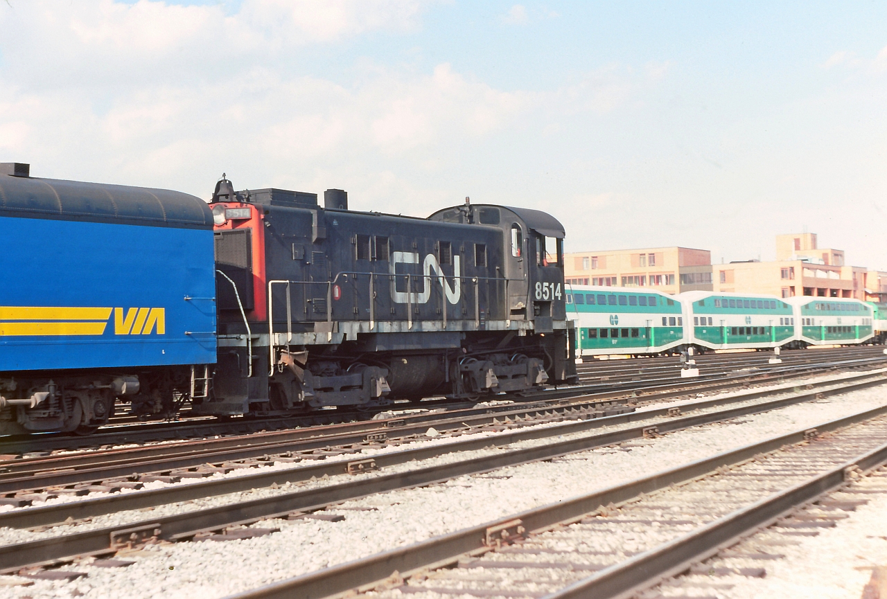 A scene from the past, some CN, VIA and GO on the east side of Toronto Union Station. Busy spot with lots to see and is all changed now. Fond memory from a trip to the area summer of 1980.