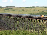 A late running VIA #2 Crosses the Battle River Trestle at Fabyan headed by 6426 and 40th Anniversary wrapped 6454