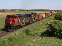 With 200 hundred new GE’s on order it seems now is the time to make the most of catching the old non-EVO locomotives. The Dash-8’s will surely be some of the first to go. CN’scowl body Dash-8’s are the last of the unique design similar to those built by EMD, GE and Bombardier, and will surely be missed. CN 2429 is one of the few that received the new company image a number of years ago and is seen assigned to stack train 148 as it heads eastbound through Milton.