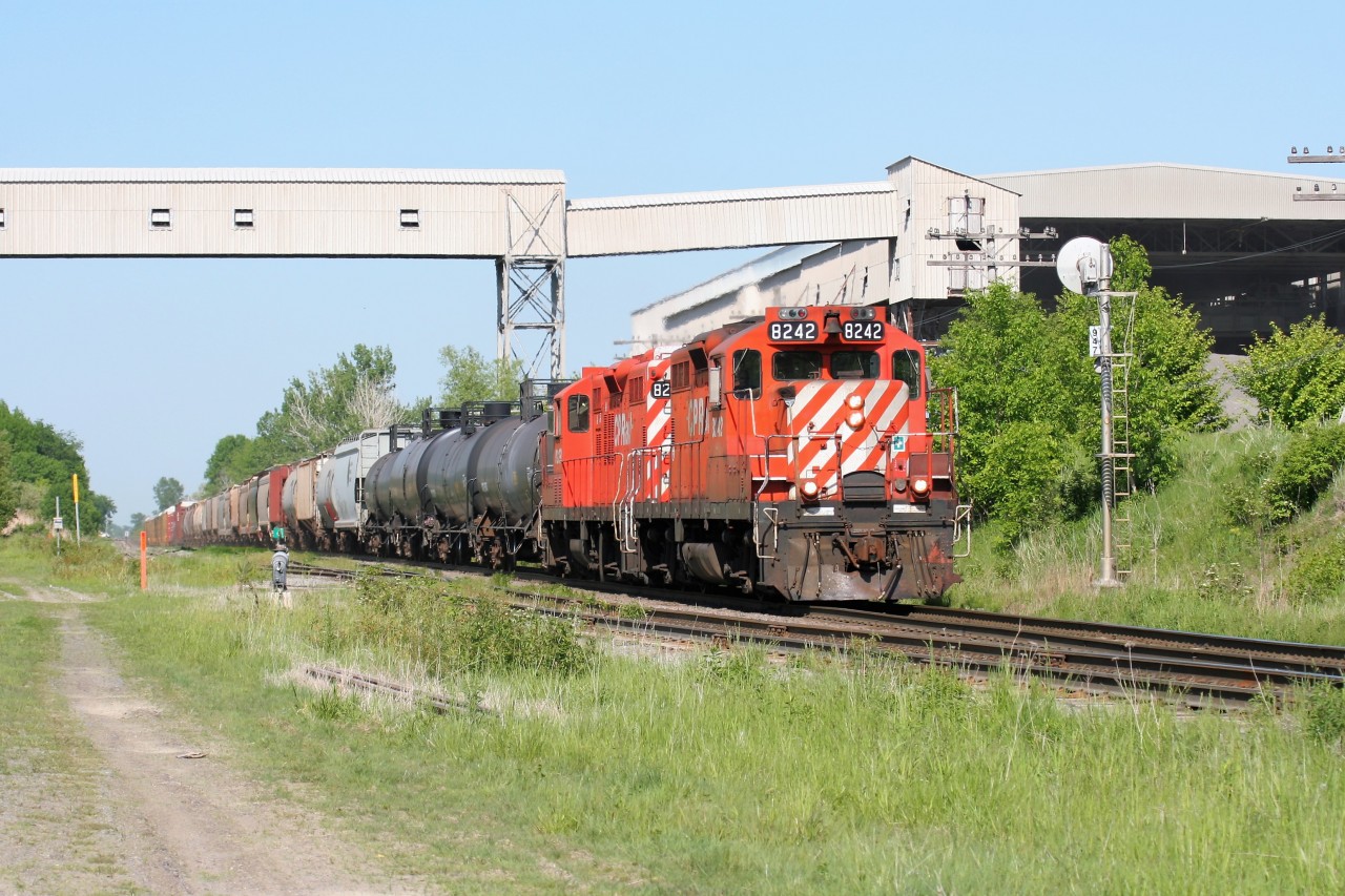 Canadian Pacific's Hamilton Turn with GP9u 8242 and a sister roll westbound through Zorra, Ontario on the Galt Subdivision.
