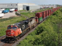 With CN’s new delivery of locomotives about to begin departing General Electric’s assembly plant. It appears that the leased power assigned to CN may not have much more time left. Here we see a former Santa Fe “warbonet” SD75 trailing on train 148 as it storms through Milton.