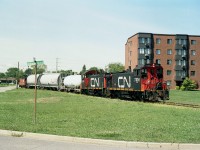 Back when I took shot this image of CN 7305 and 7316 running the Fonthill Spur back to the Canal Line, it would be only a month before CN gave this up to PCHR,(Port Colborne Harbour Railway)-now Trillium. This was actually the last time I saw CN service business on this trackage. The view is from the corner of Lyndon St. W and Ormond St S., and the area still is pretty much the same as it was, save for the fact the apartment building has solar panels on the end.