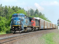 A great classic lash-up heads west on the Halton Sub out of Georgetown in charge of CN 271 on this hot morning. IC (CN) blue 2460 and CN 2451 charge westbound with autoracks making up train 271. Note the CN 2451 is still in the CN North America paint. 
