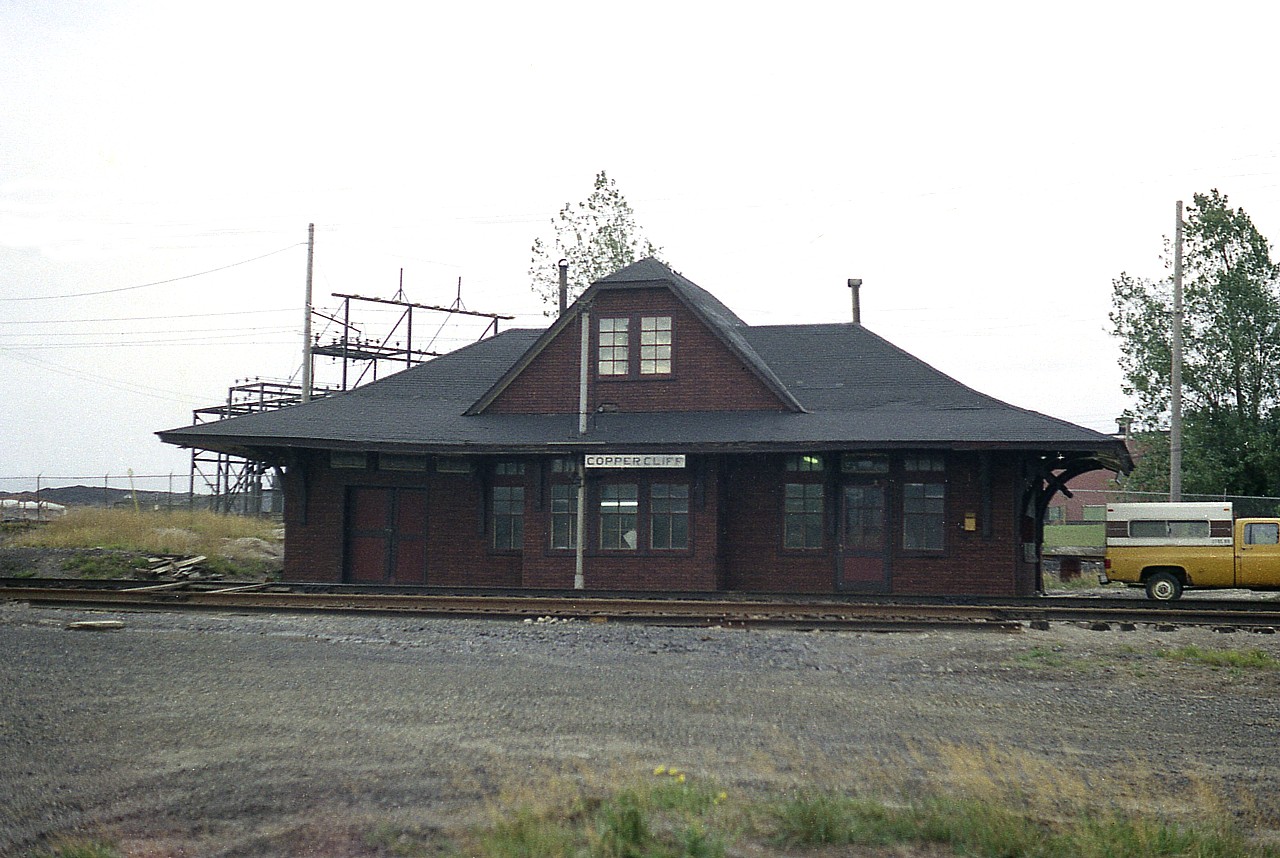 The rather dilapidated looking station was located at mile 4.7 CP Webbwood Sub. That is about all I know of it, and am seeking information. Probably built before 1900; as there are records of a 'decorated station' for the first trans-continental passenger train stopping there in 1886. But I do not know if it was the same building, constructed new at that time. I believe the structure was torn down in the late 1970s, replaced by one of those little rectangular pre-fabs that CP made good use of in the North. Copper Cliff, once actually larger than Sudbury itself, was known for its huge smelter smokestack, one of the world's largest. The town became part of the Regional Municipality of Sudbury in 1973.