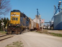 After dropping 5 hoppers and lifting 2 from the elevator behind, CSX local D724 accelerates west out of Tupperville at 15:29hrs heading towards Wallaceburg where he'll drop the head end hopper. Then, the slow trek back to Sarnia begins, arriving there after dark. The day started at 08:00 when the local departed Sarnia with 35 cars, 29 of which were bound for the SouthWest CO-OP in Wallaceburg.