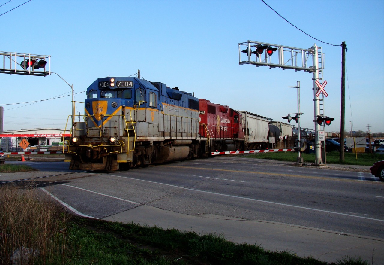 DH 7304 and sister unit CP 7307 head out of Windsor yard with a 14 car local on their way to service customers along the Windsor Sub.