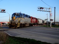 DH 7304 and sister unit CP 7307 head out of Windsor yard with a 14 car local on their way to service customers along the Windsor Sub.