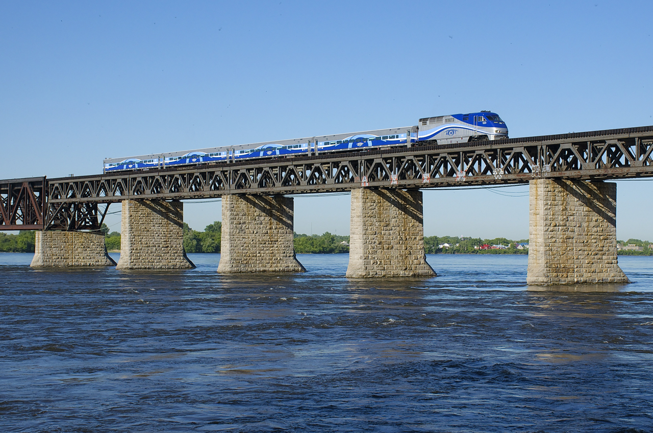 AMT 1323 pushes a deadhead move towards the South Shore of Montreal.
