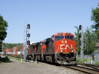 CN 120 is splitting a pair of signals which had been installed a couple of years back, but were only put into service during the past few months, replacing a pair of dwarf signals. Power is CN 2961, CN 2332, CN 2120 and DPU CEFX 1018 on this 612-axle long intermodal train which is bound for Halifax.