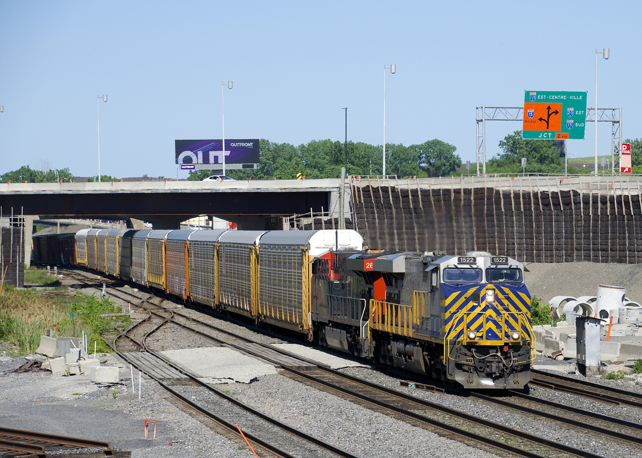 ES44AC's CREX 1522 & CN 2864 lead CN 401 through Turcot West, underneath a recently completed section of highway.