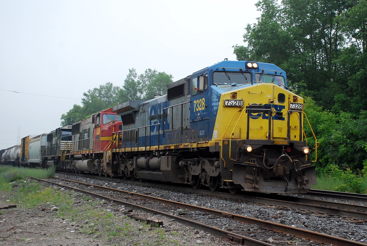 GECX 7328, PRLX 228, and NS 6911 slowly lead X384 past Copetown.  The engineer appears to still be in good spirits despite having a junker leading the consist.  I'm sure the crew was thrilled when they saw their consist in Sarnia.
