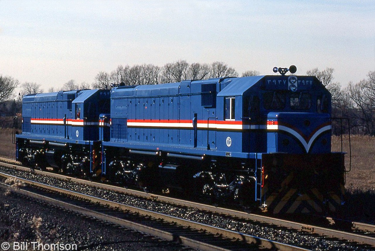 Two newly built EMD G22W-AC locomotives for the Egyptian National Railways are seen on the test track at the GMD London locomotive plant. The lead locomotive number is 3937, part of a large order of 228 G22W-AC's (AC for alternator equipped instead of a DC generator) built at London in the early 80's for export overseas to Egypt.