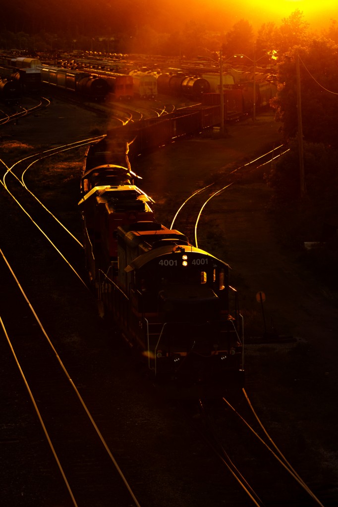 This Wheel's on Fire.
A trio of EMDs work CN's Stuart Street Yard as the sun sinks below the horizon in a fiery orange glow.