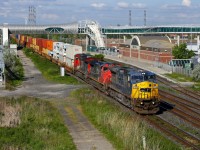 CN 149 charges through Liverpool with a leased unit leading the way.