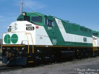 Brand new GO Transit F59PH units 565 & 566 sit at CN's London yard, freshly minted from the nearby GMD London locomotive assembly plant. Units 562-568 were GO Transit's final order of seven F59PH's delivered in 1994 (which GO traded in GP40's 720-726 on them, that became EMDX 200-series leasers). Due to cuts and lower ridership in the mid-late 90's, GO sold off four units (565-568) to Trinity Railway Express, apparently the reason being they'd get more for selling newer units than their older ones. 562-564 remained and continued to operate for GO with the rest of their F59 fleet, and today remain a few of the handful of rebuilt F59's GO still operates.<br><br><i>Dave Stowe photo, Kodachrome from the Dan Dell'Unto coll.</i>