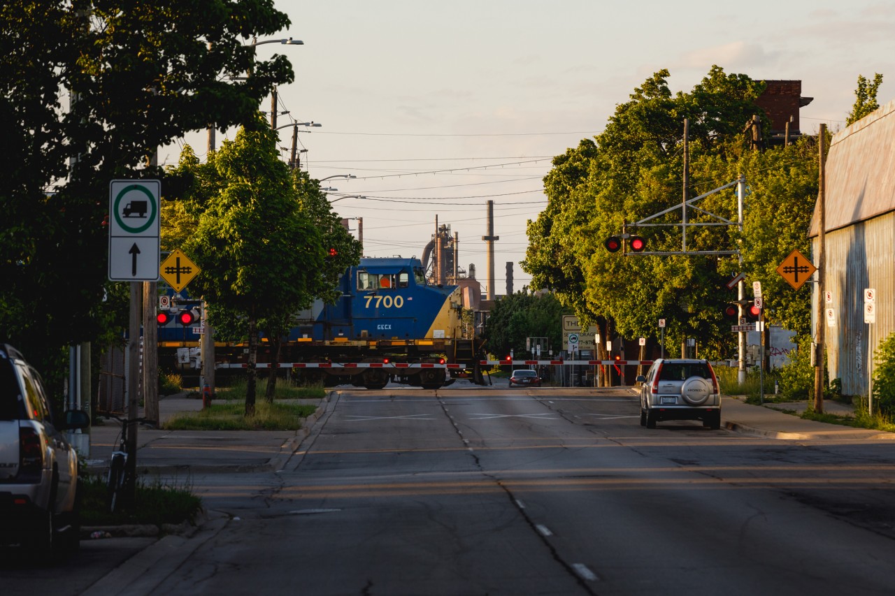 This (former) CSX GE C40-8W and the steel mills in the background set a scene that looks more like Illinois than Ontario. Nonetheless, GECX 7700 is seen guiding CN train no. 330 across Sherman Avenue on a pleasant June evening in Hamilton, Ontario.