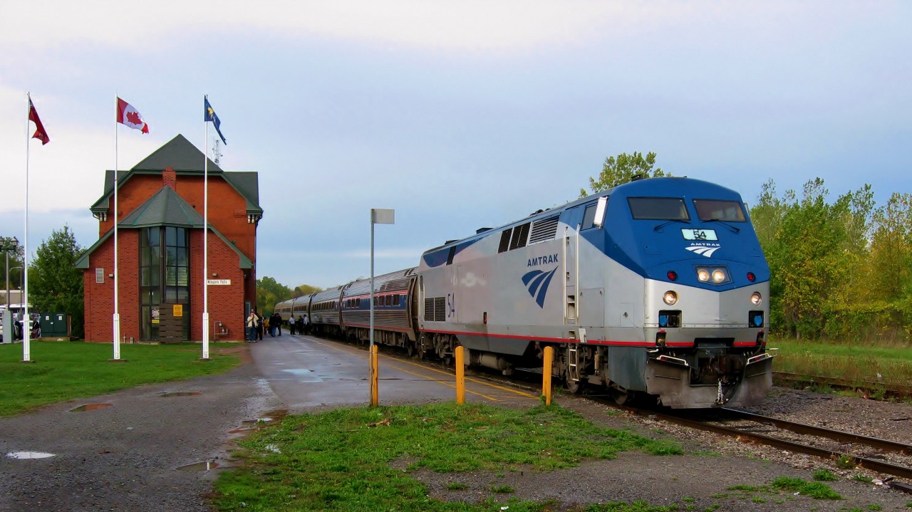 AMTRAK ADVENTURE. Amtrak's Train No. 97, the 'Maple Leaf' has just arrived from Toronto on October 19, 2007 en route to New York. The train departed Toronto as VIA # 64 and operated by Canadian crews until arrival at the Niagara Falls Station. An operating agreement will now see it run by Amtrak American crews for the remainder of the run to New York's Penn Station with the passengers having to clear customs on the Niagara Falls NY side. This long planned Father-Son hockey trip to see their beloved Leafs play at the the Air Canada Center gave both this Newfoundland photographer and his youngest son Thomas a chance to ride not only some passenger trains but also Toronto's famous streetcars. Having flown from St. John's the previous day and taking VIA No. 35 from Dorval, a day trip to see Niagara Falls was commenced on VIA 64/Amtrak 97 that morning with return on the quite comfortable Amfleet Coaches of Amtrak 98/ VIA 63 that same evening. Wanting to experience a full Original-Six hockey experience with Toronto hosting Chicago, the two travelled by train as would the teams when the NHL was born.