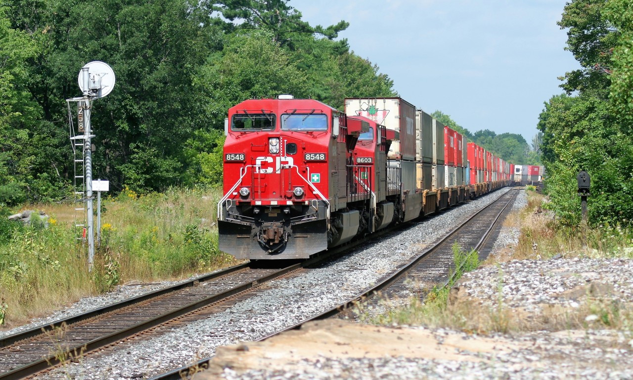A southbound Canadian Pacific intermodal train with AC4400CW's 8548 and 8603 pause for a crew change at MacTier, Ontario.