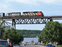 It's hard to believe I took this more than 10 years ago. CN SD50F 5459 and GTW SD40-3 5947 lead a northbound train over the Seguin River in Parry Sound, Ontario. The train is crossing the large 1695 foot trestle bridge which was built during 1907 and stands 115 feet above the Seguin River and the Parry Sound Harbor.