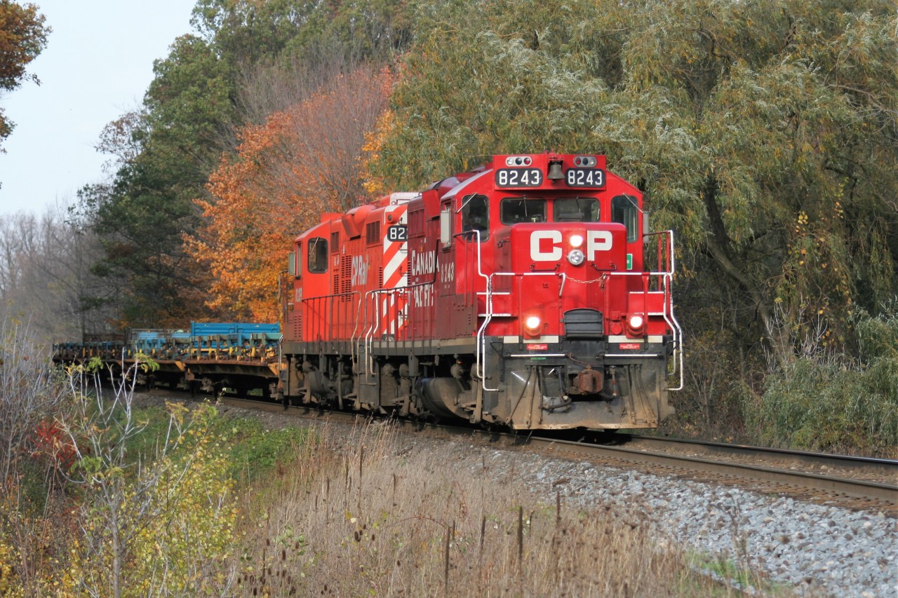 CP GP9u's 8243 and 8229 lead a short train 141 at Orrs Lake hill, west of Galt, Ontario on the Galt Subdivision as they head westward towards St. Thomas.