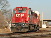Canadian Pacific train T69 is seen departing Galt, Ontario as it enters the mainline with SD40-2's 5879/ 6601 after lifting auto racks from the Toyota facility. 
