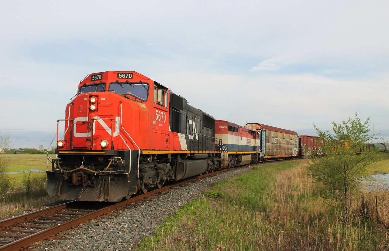 CN A438 rounds the curve that ties the CASO Spur into the Pelton Spur. Pelton at one time was a diamond between the CASO Subdivision and the C&O Sub 1. After CSX left the area, CN took the section of Sub 1 between Pelton and Walkerville Junction, renamed it the Pelton Spur, and built a seamless connection between it and the CASO via a wide sweeping curve. Today, there is not a whole lot left of Pelton. No trains actually pass the spot where the CASO and Sub 1 crossed each other as the curve CN built starts further west at Walker Road.
