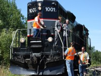 While city officials tried to lighten the mood, this day and event for railroaders and railfans alike was a sad affair. July 14, 2011 marked the last day of rail service to the town of Collingwood. Barrie - Collingwood's GP9 #1000 ran to the end of serviceable track in town, stopping for a short celebration of the towns railroad history before the train and crew returned to work lifting tank cars from the last two customers in town, later retracing its steps back to Utopia for the very last time. It was several weeks since the train originally dropped the cars in town and that type of service can not justify a lines survival. Today most of the rails to Collingwood are still intact but the possibilities of rail service ever returning is very slim. 