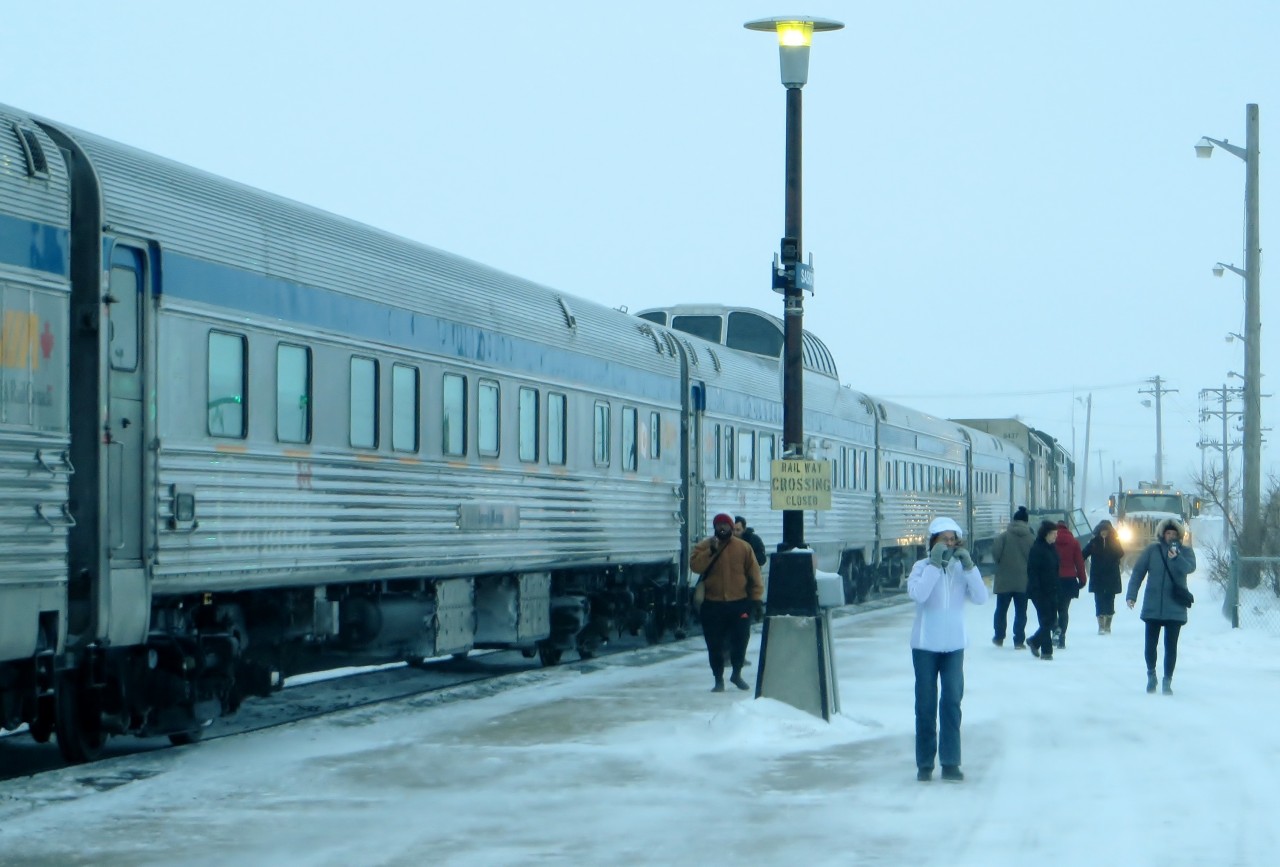 SUB-ZERO SASKATOON. I was reminded of the Guess Who's classic hit song 'Runnin' Back to Saskatoon' as the 'Canadian' arrived some 11 hours late and through a fierce Prairie blizzard to Saskatoon on January 30, 2018. During our quick stop to refuel the engines, some passengers - including the photographer and his wife- decided to walk about in the -20C temperature but quickly re-boarded to enjoy a hot coffee in the warmth of the dome car 'Glacier Park'. With the rear of the train barely visible through the snow, the blustery wind and the freezing temperature of that frigid morning quickly brought about a desire for the long hot days of a Saskatchewan summer.