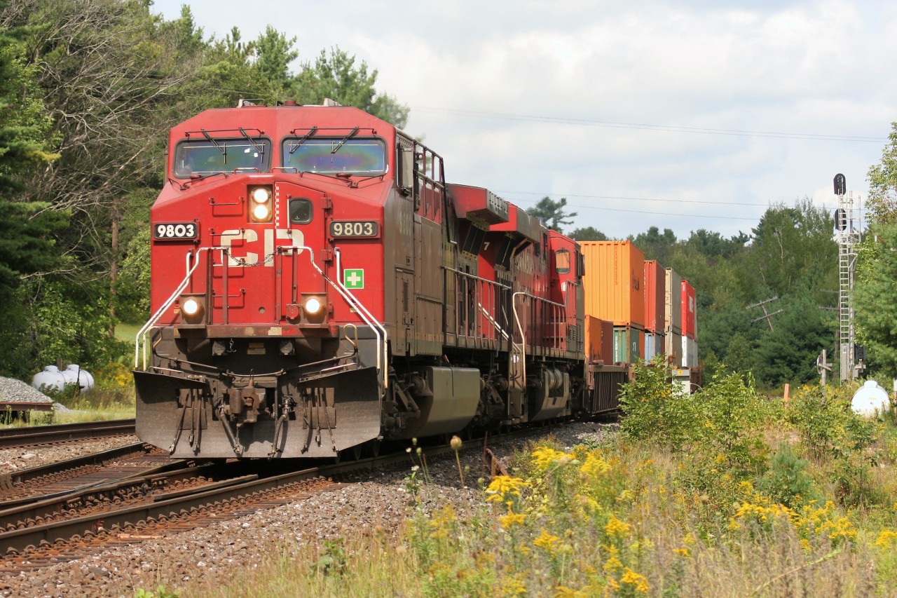 A southbound Canadian Pacific train with AC4400CW 9803 is coming off the CN Bala Subdivision at Boyne Junction and will diverge back onto the CP Parry Sound Subdivision to continue it's journey to MacTier and eventually Toronto.