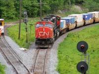 A foreman and his track equipment have cleared in the siding at Falding, Ontario to allow an intermodal train led by SD75I 5749 and a sister to continue their journey northward on the Bala Subdivision. 