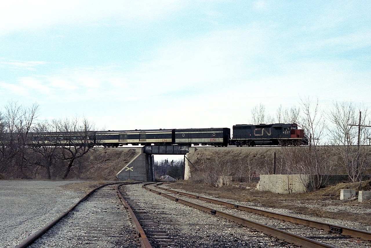 Well, having just posted a "VIA" shot, one could say it was to commemorate VIAs 40 Years now that we are 2018, and so I figured, 'what the heck'....here's another from VIAs 1st full year ........even though there is no indication this is anything other than a CN passenger train. CN 4017, a GP40 was often seen in passenger service along with sister 4016. (the series 4002-4017 were renumbered to 9302-9317 in 1981). This eastbound has just crossed the Grand River Bridge and is seen over the former Lake Erie & Northern track, at the time actively operated by CP.
