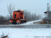 Some snow to cool y'all off. On this day I had 4 hours to kill and in 3 hours (with 1 hour of travel booked) I first managed to find the <a href=http://www.railpictures.ca/?attachment_id=27476 target=_blank> Resolute Forest Products switcher</a> <a href=http://www.railpictures.ca/?attachment_id=27440 target=_blank>(Image 2)</a>, then I found <a href=http://www.railpictures.ca/?attachment_id=30470 target=_blank>Trillium</a> working and followed them around for an hour, and on the way back toward Hamilton, I ran into this critter! What luck! Mother nature was angry and the squalls were moving north with me, and finding this guy was a real treat regardless of the weather. This is the former double track CASO mainline, with a track now removed from the HWY 140 crossing. This engine, ex Stelco is heading back to Martech's home base having delivered a load of fresh pipes to Southern Yard. Martech Industrial Services has two GE critters, #816, and a blue-white 80 tonner (OSH Rail Operations 101) both in service. What I didn't know at the time is Martech crews operated both the RFP train and this train, probably the same crew as some time had passed between both runs. RFP was switched by Trillium from 2014 to 2016 (Using RFP power) and using Martech crews until they closed at the end of 2016. Brrrrrrr.