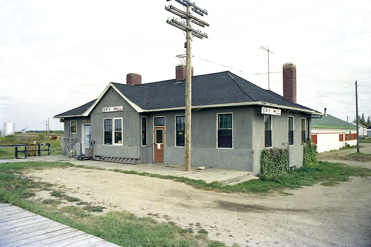 Another one of those nondescript little communities out on the prairie, Spy Hill derived it's name from a hill that is nearby. Like the village, it is not much of a hill. However, the people of Spy Hill, all 200-odd of them, made the news last winter, when on Christmas Day 2017; the "Canadian" broke down and rolled into the 6200 ft siding in town and was rendered helpless. Windchills were approaching -50F and many of the cars went cold, the toilets stopped working and the power was out. An "SOS" went out and the townsfolk came to the rescue. All 98 passengers had to trundle thru the cold to the community hall, where it was already decorated for Christmas. Food was served up and everyone looked after until buses came to rescue the stranded. A novel way to spend Christmas Day! And so for awhile, Spy Hill was not just another forgotten community in the vast prairie flatlands. Pity about their station though. I shot this in 1976, but any efforts to find what has happened to it have fallen as flat as the land itself.  I only know it has been gone more than 20 years..........