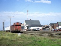 Lets just say this image is for those on Railpictures that either reside on PEI or are frequent visitors, as this is just a general scene. It features the CN Summerside station (now a library)and a boarding car train left on the southernmost track in the diminutive 'yard'. Some of the downtown business district is on the right and in the distance ahead of the cars is the track running left to the pier, which was active at this time as I saw CN 1750 switching and a ship at anchor. A nice old time scene, as the railroad is now gone from the Island (1989) and the track area is now parking lot for the Loyalist Lakeview Resort. The mainline is now Confederation Trail.