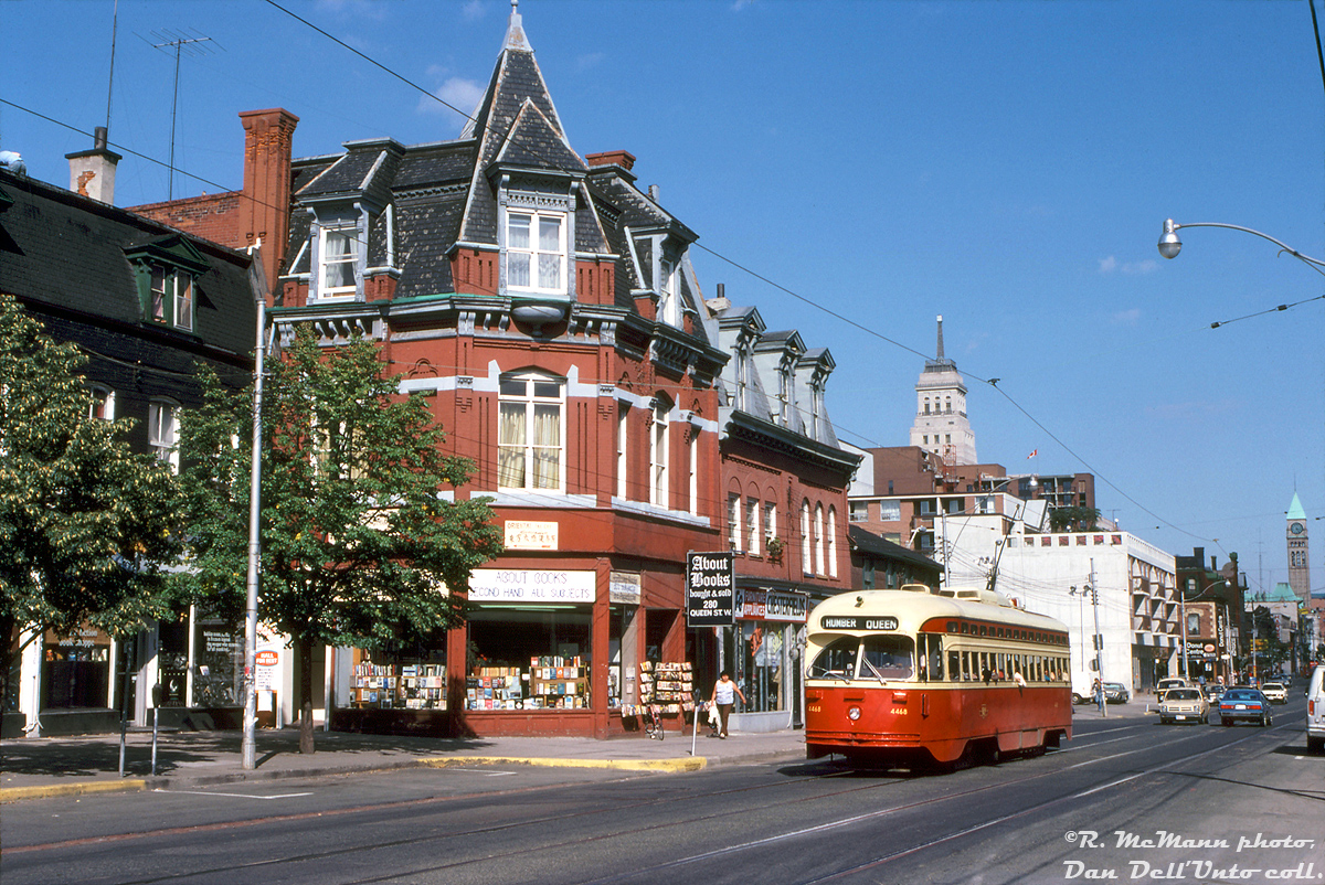 A sunny late afternoon finds TTC PCC 4468 (an A7-class car built new for the TTC in 1949) heading westbound along Queen Street near Soho Street, passing some of the small shops and Victorian-era storefronts lining the downtown street. 
About Books is just one example of the ever-present secondhand book stores that used to (and still do) dot parts of Toronto, where you could find anything from classic literature such as The Big Sleep, A Clockwork Orange, MacBeth, and Murder on the Orient Express to more modern offerings such as movie novelizations, romantic novels, and dime-store thrillers (and sometimes university texts for one's English literature courses).

Today this store front is occupied by a woman's fashion boutique, a reflection of the gentrification that part of Toronto has gone through a stone's throw away from trendy "West Queen West" - full of chic fashion retailers, sidewalk patio restaurants and cafes, coffee houses and Yoga studios that the young working professionals who live in the area frequent.

Robert D. McMann photo, Dan Dell'Unto collection.
