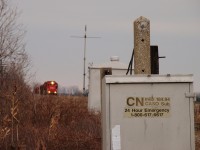 A very slow trek down the CASO, GTW 5937 and CP 5746 are seen here approaching Gleeson Line, former site of one of the infamous pairs of wig-wags along with a hotbox detector that existed here in operation until the line was abandoned in 2011. This being the first train down the line since May 2011 - over 78 weeks - there were many delays, including every crossing. Several crossings had been paved over and all gravel roads had been covered in road debris, so personnel were sent out in the days before this to clear out the flangeways. It was still rough. CN and CP provided power on this rail train as they both had ownership in the line. These rails would be gone by the end of December.