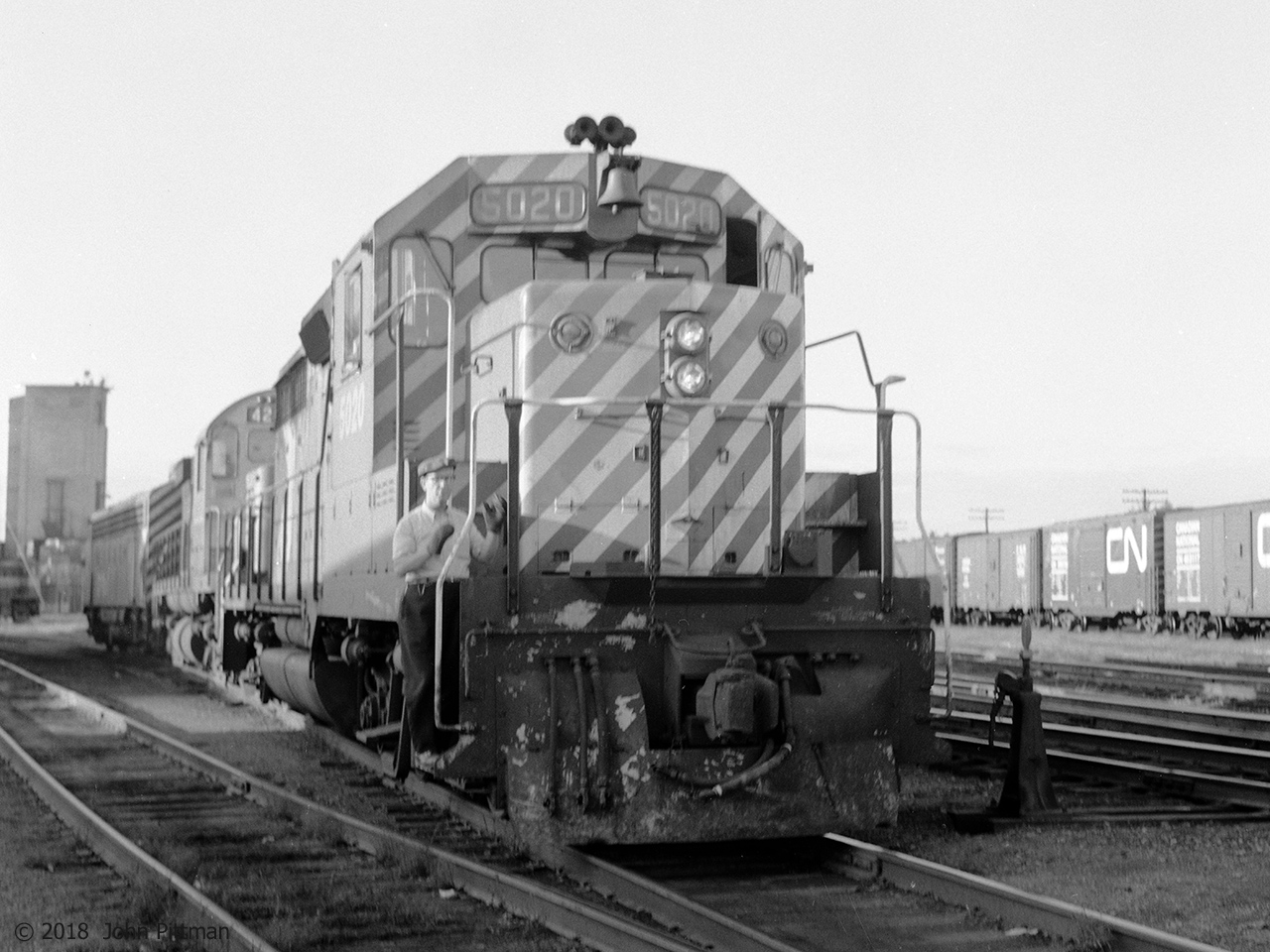 A CP Rail GP35 is leading a C424 and an FP7A (probably CP 4075) out of the Trois-Rivieres engine track.  Next it will back down onto the train that the yard switchers have assembled, for the return journey to Montreal.  The coaling tower, long out of use, is in the background.  Looks like I am getting a wave from the brakeman on CP 5020.  
Largest volume of freight traffic here was newsprint paper from the paper mills along the St Maurice River, especially those in Trois-Rivieres and Cap-de-la-Madeleine. 
The coal tower, roundhouse, some of the tracks, and the adjacent east-side neighbourhood were cleared to make room for Quebec Autoroute 40.  The passenger station remains but has been re-purposed.  CP has left town; their Montreal to Quebec north shore route is now operated by the Quebec-Gatineau Railway.  
An image that looks like the tail end of this consist:  http://www.railpictures.ca/?attachment_id=21505