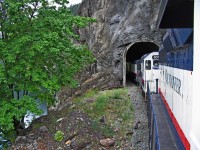 A quick grab shot, exiting a short tunnel. Despite a lot of white paint on the locos and coaches, the train always looked very clean and bright. I like this paint scheme on the locomotives and coaches much better than the current paint scheme. 